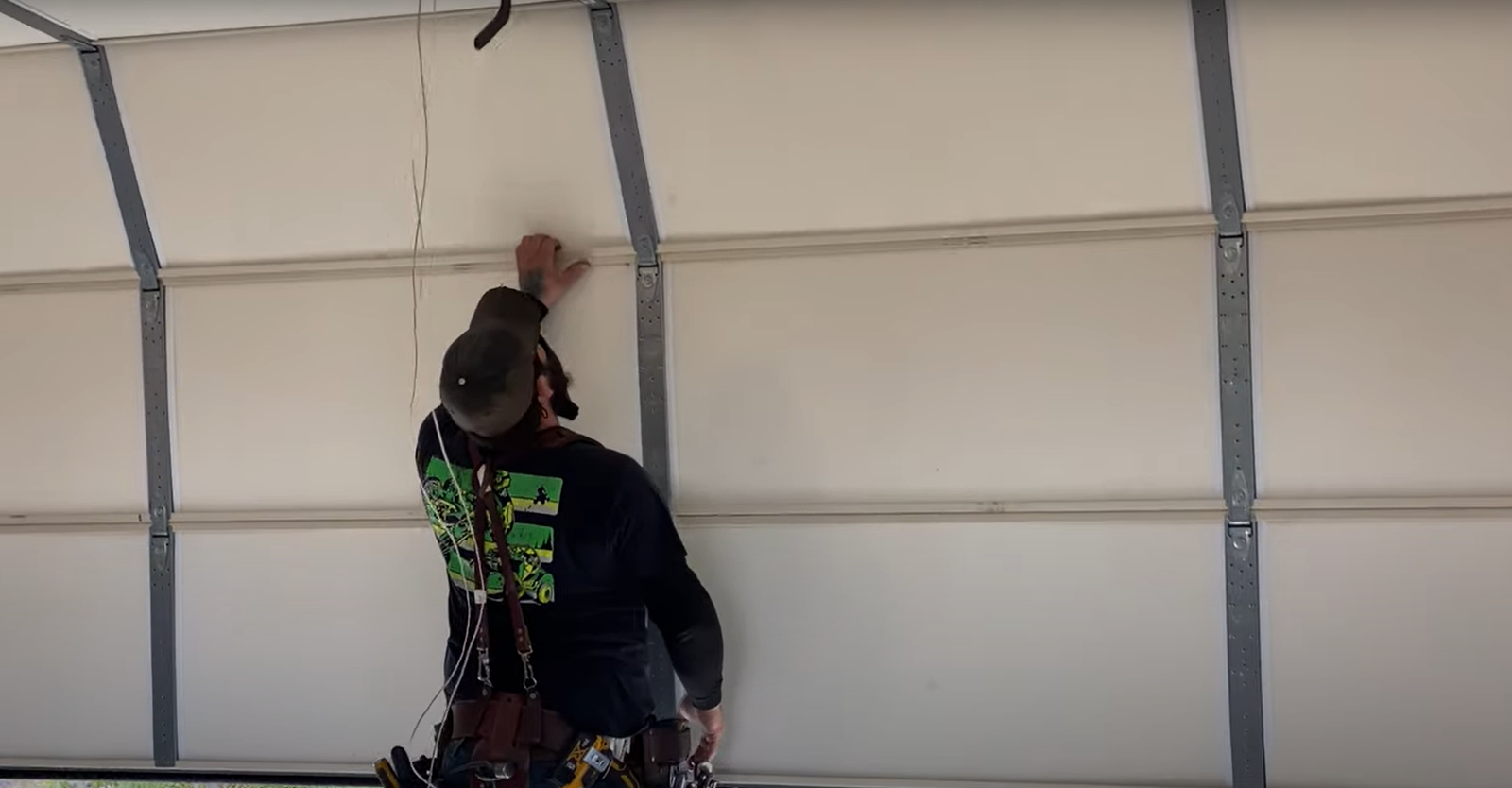 A skilled technician providing expert overhead garage door repair services in Arcadia, Florida.