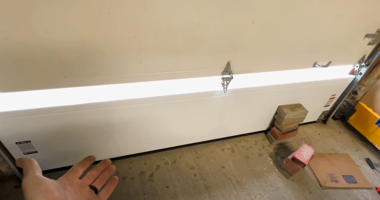 Technician performing garage door panel repair in Arcadia, Florida, ensuring smooth and safe operation of the door.