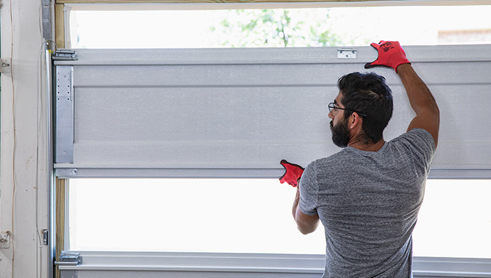Technicians performing a new garage door installation for a home in Arcadia, Florida, highlighting professional garage door services.