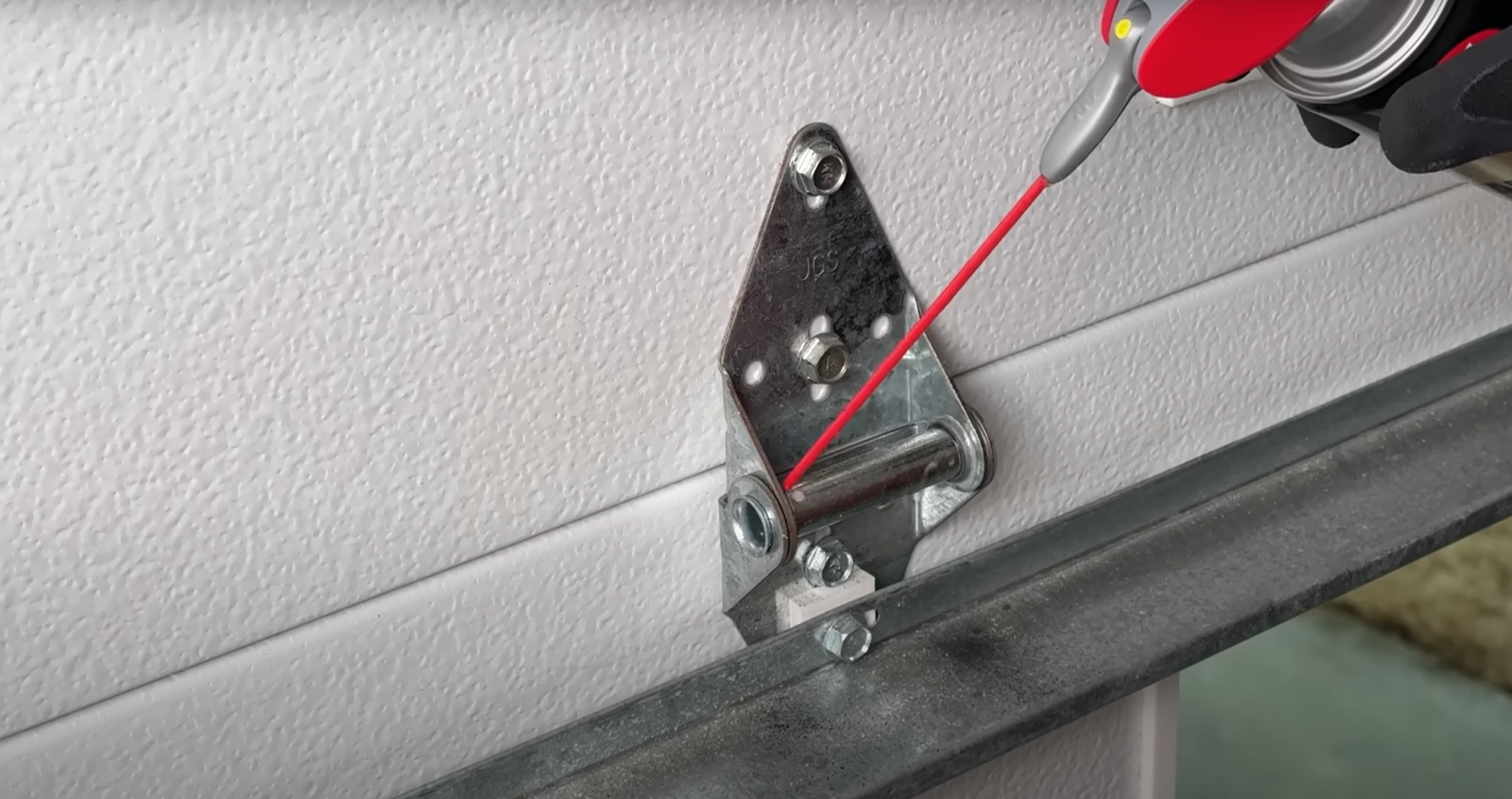 Technician repairing a noisy garage door in Arcadia, Florida