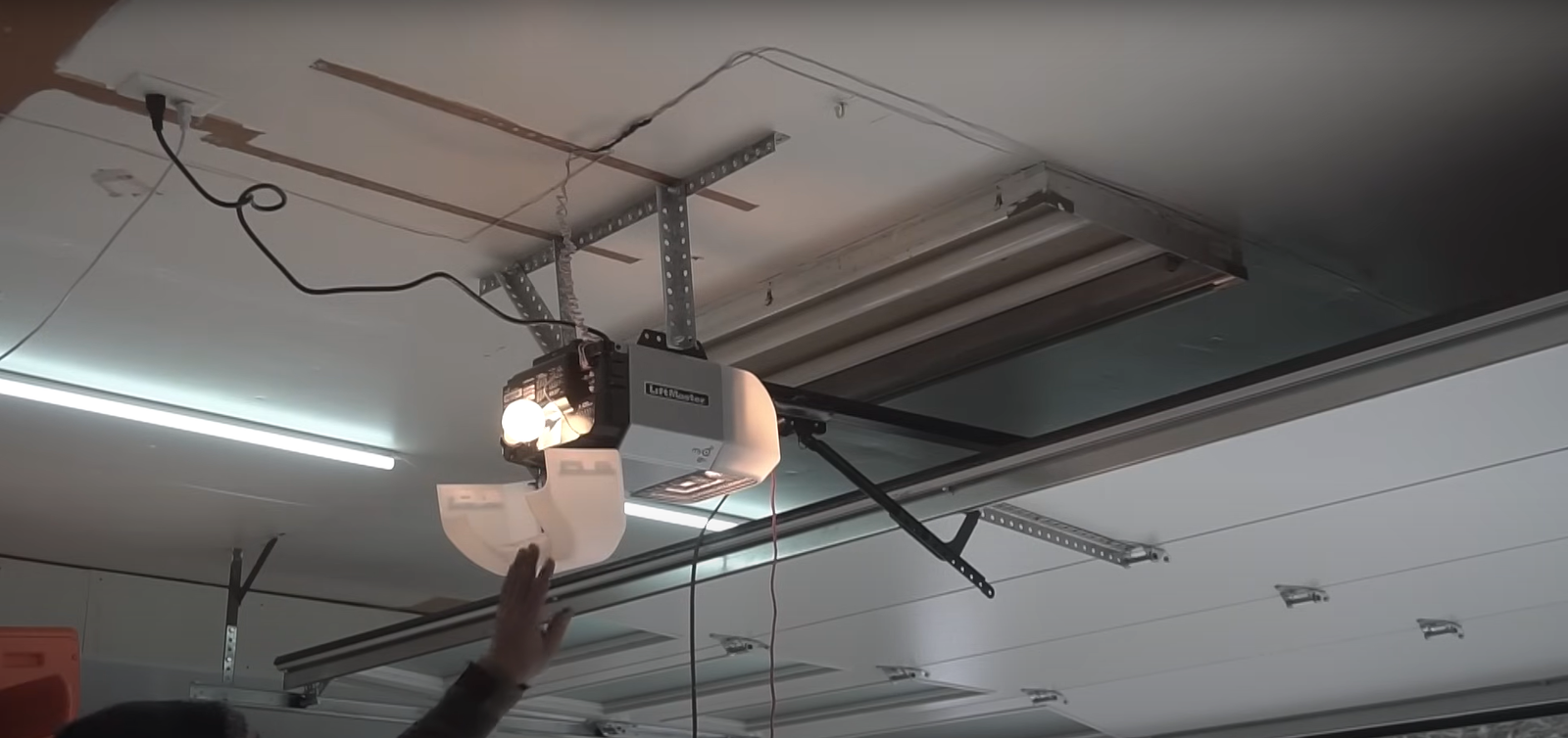 Technician performing garage door opener installation in Arcadia, Florida