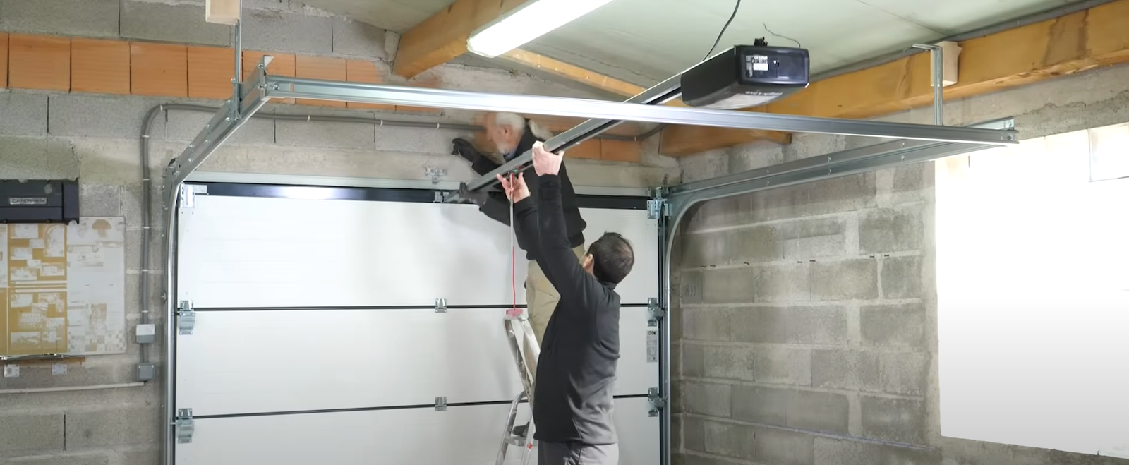 Technician performing garage door opener repair in Arcadia, Florida